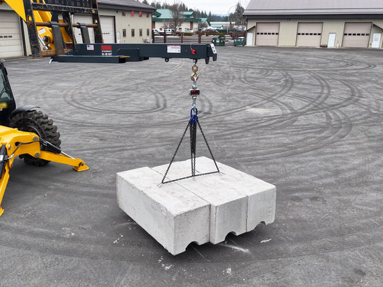 IA-JB-60T proof test: boom extended with concrete ballast blocks suspended from the crane scale